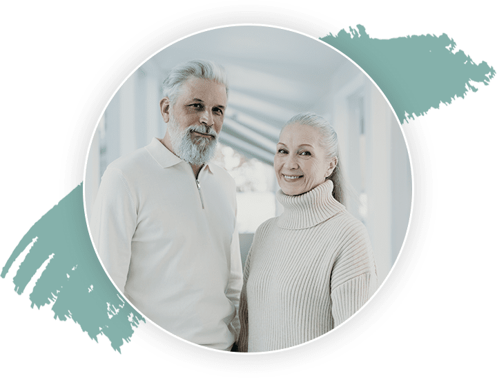 Elderly Couple Standing Together in Their Home